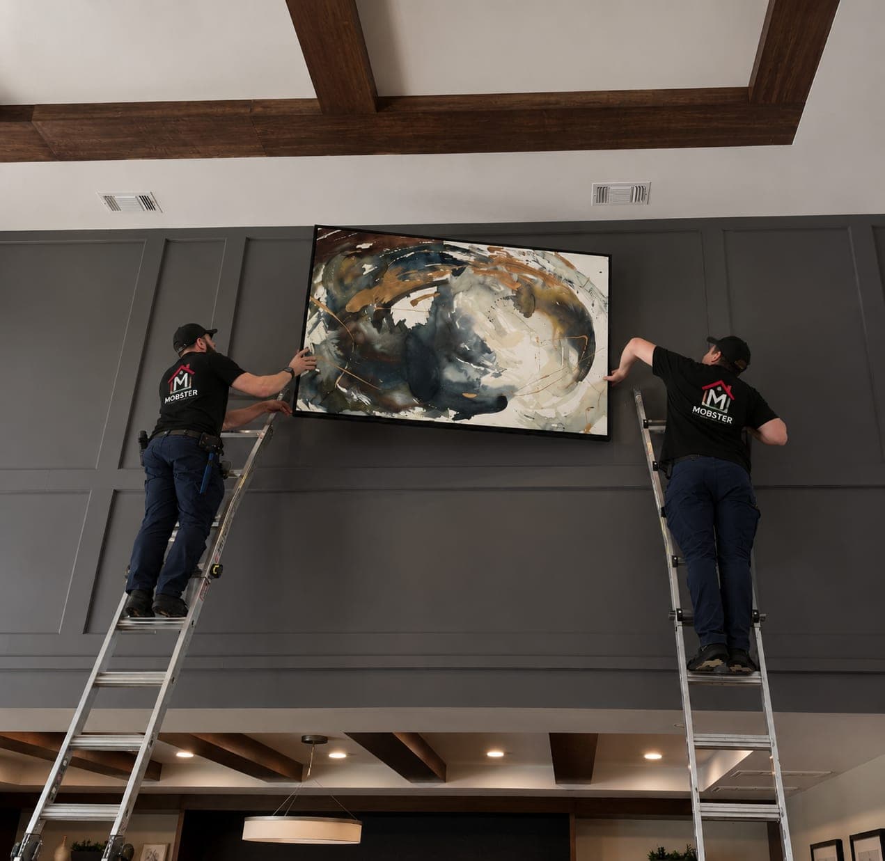 Two Mobsters on ladders hanging an oversized canvas on a panelled wall